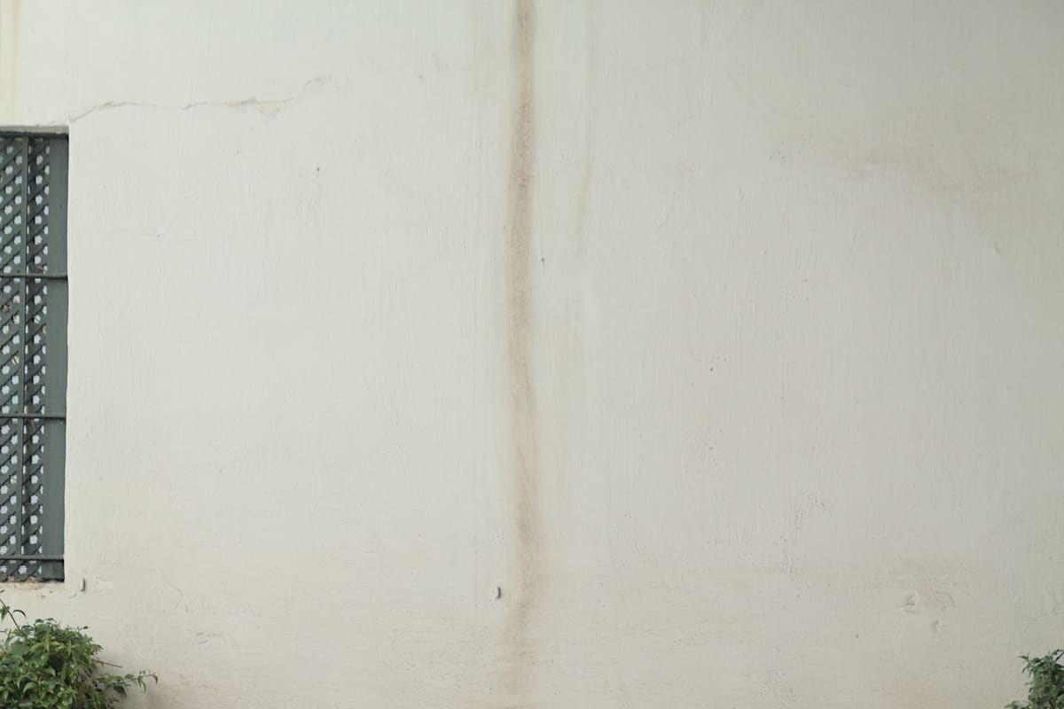 The Patio de las Doncellas at the Real Alcázar de Sevilla — Moorish horseshoe arches, intricate stucco, and a reflecting pool in the Mudéjar style, inscribed UNESCO World Heritage 1987